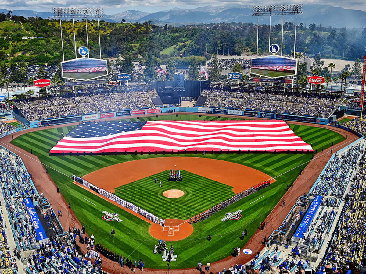 The story behind the massive American flags at sporting events