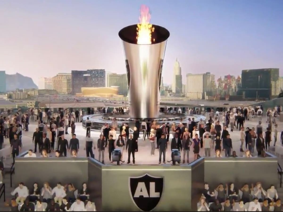 Allegiant Stadium construction workers light Al Davis Memorial Torch