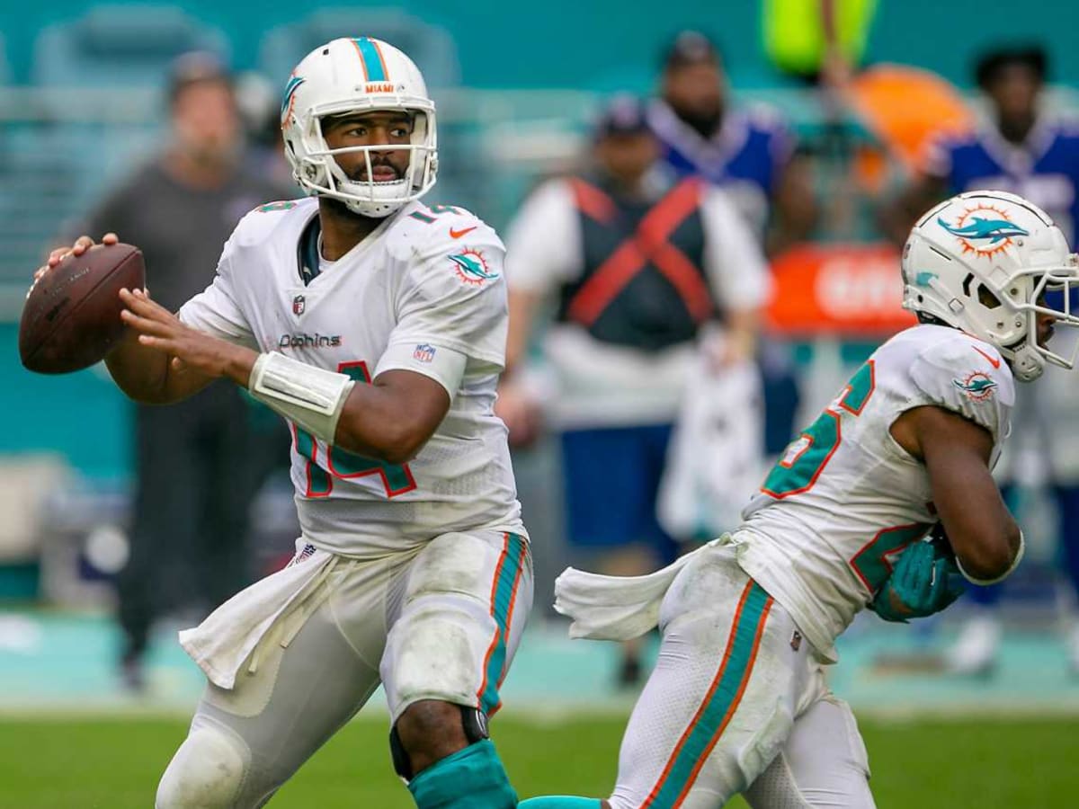 Miami Dolphins quarterback Jacoby Brissett (14) walks the