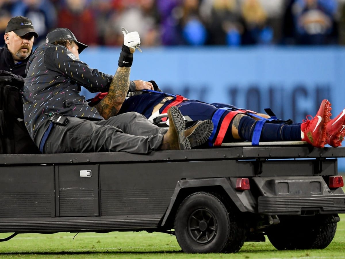 Titans' Taylor Lewan carted off with knee injury vs. Bills