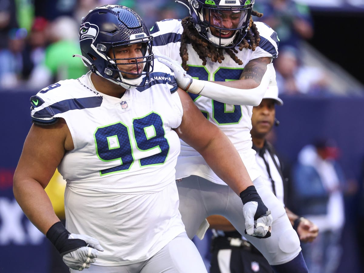 Seattle Seahawks defensive tackle Al Woods (99) rushes in against