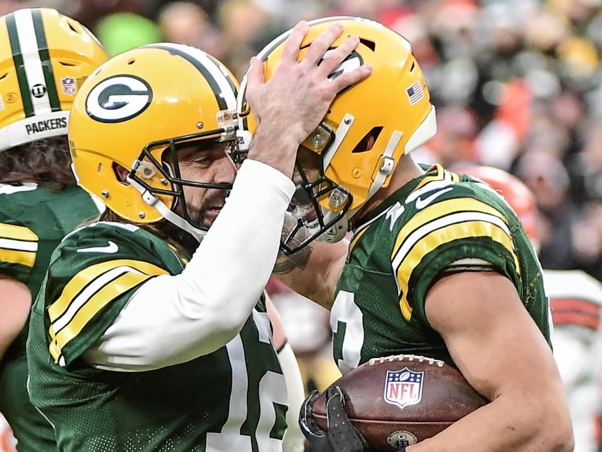 Green Bay Packers quarterback Aaron Rodgers pumps his fist after throwing a  7-yard touchdown pass to receiver Greg Jennings during the first quarter  against the New Orleans Saints at Lambeau Field on