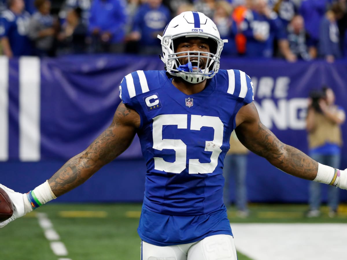 Two Indianapolis Colts fan measures themselves against Indianapolis Colts  linebacker Darius Leonard in Indianapolis Colts City at the NFL team's  football training camp in Westfield, Ind., Saturday, July 31, 2021. (AP  Photo/Michael