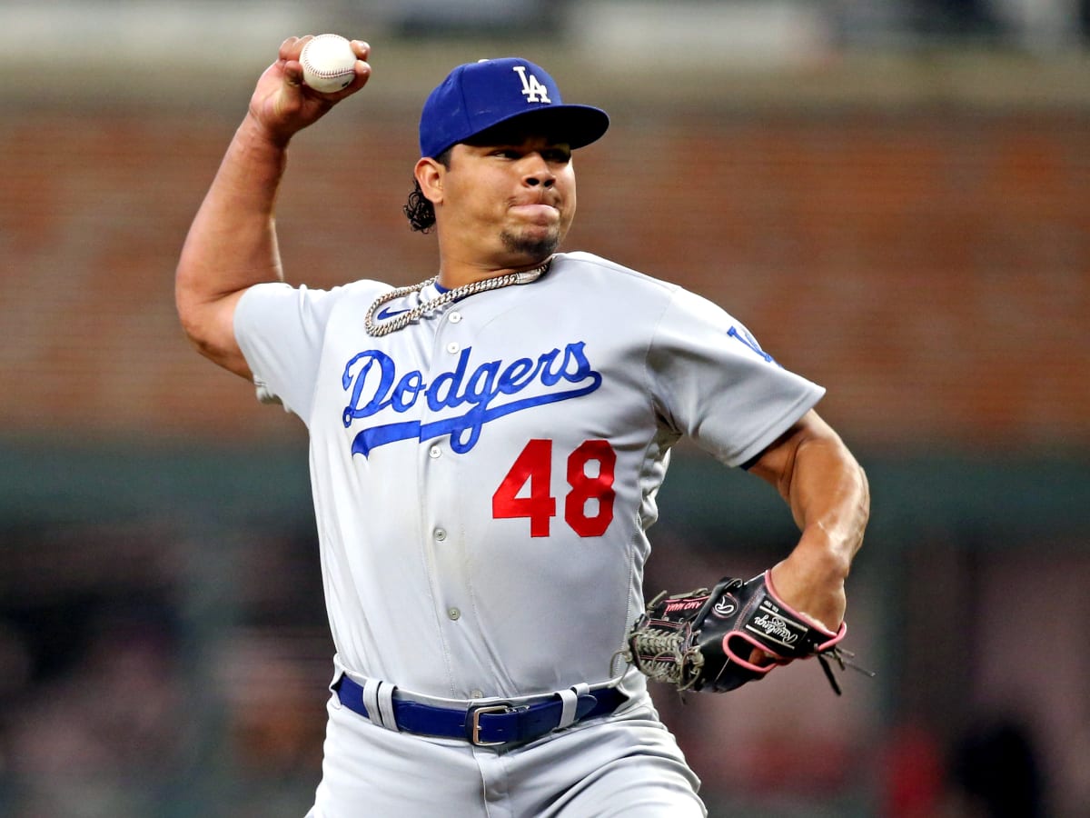 Dodgers' improved pitching helps them take command of division