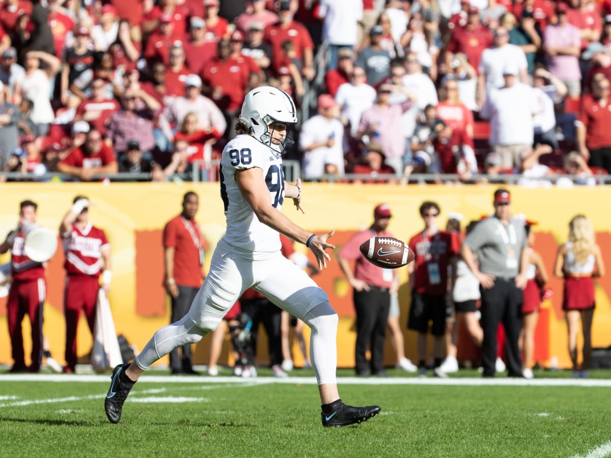 Baltimore Ravens' Jordan Stout (11) looks on after holding for