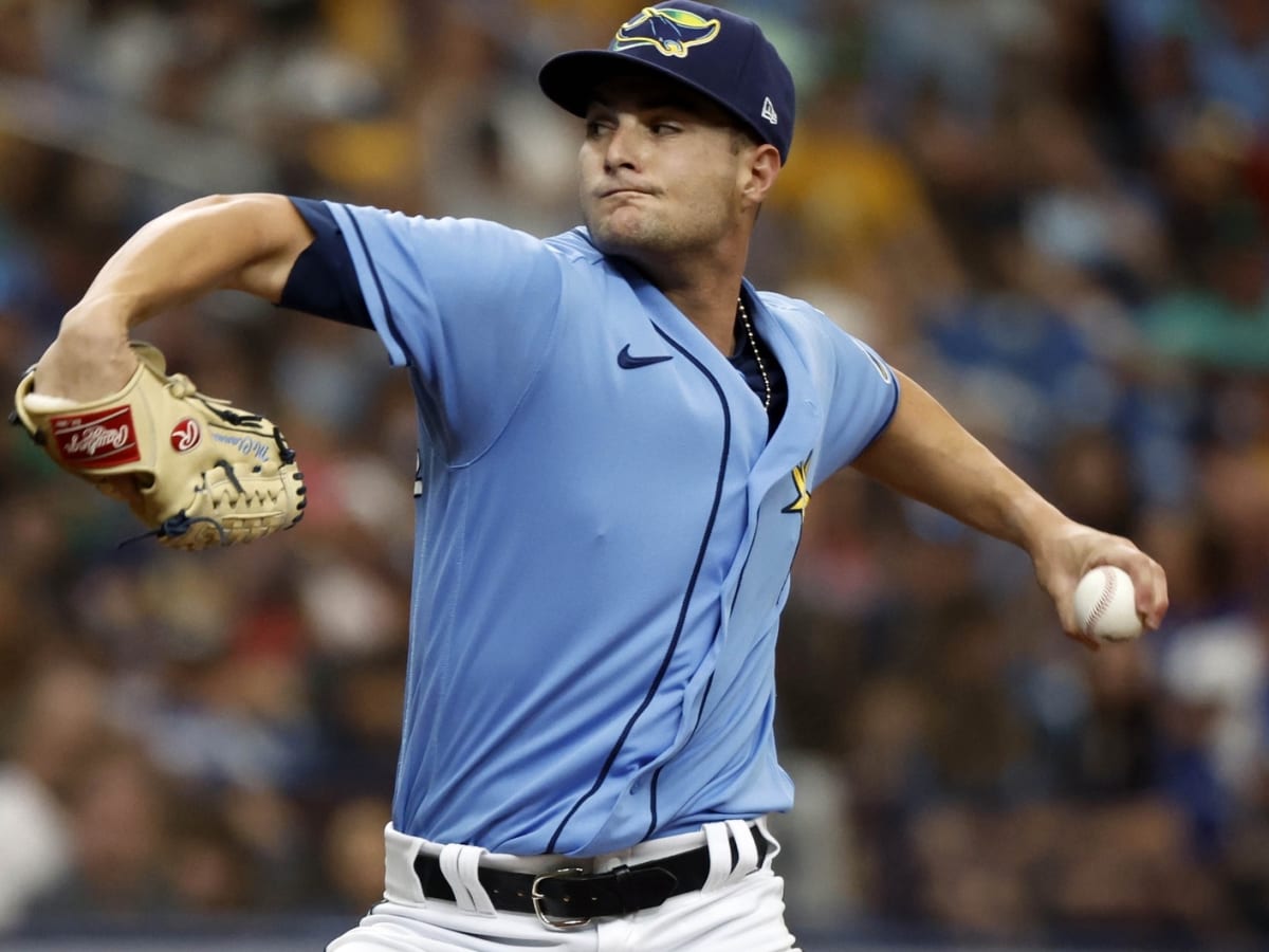 Port Charlotte, FL USA: Tampa Bay Rays starting pitcher Shane McClanahan  (18) was watching the game during a spring training baseball game against  the Boston Red Sox, Tuesday, March 22, 2022, at