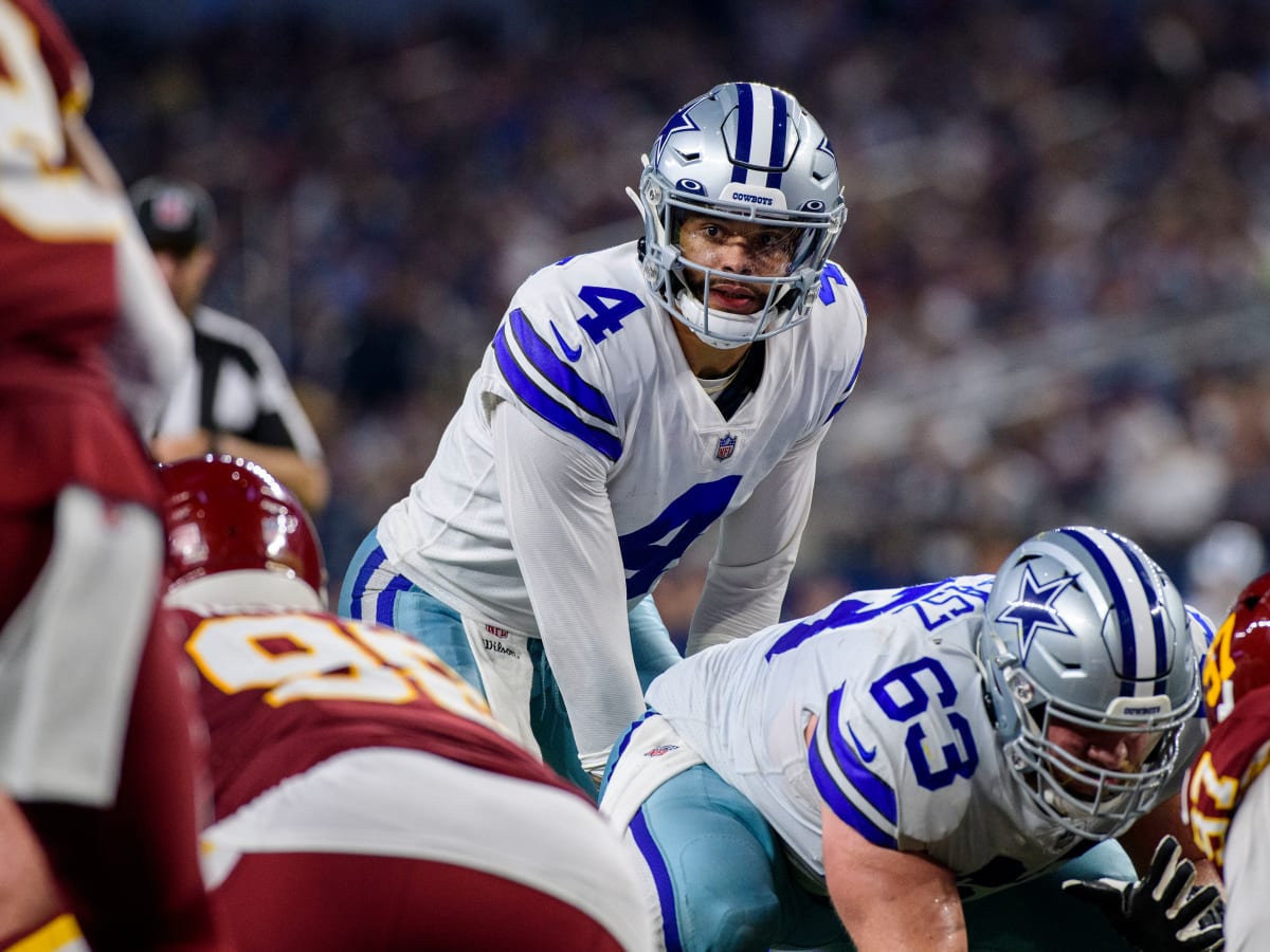 Arlington, United States. 24th Dec, 2022. Dallas Cowboys Dak Prescott gets  stopped by and Philadelphia Eagles T.J. Edwards during their NFL game at  AT&T Stadium in Arlington, Texas on Saturday, December 24