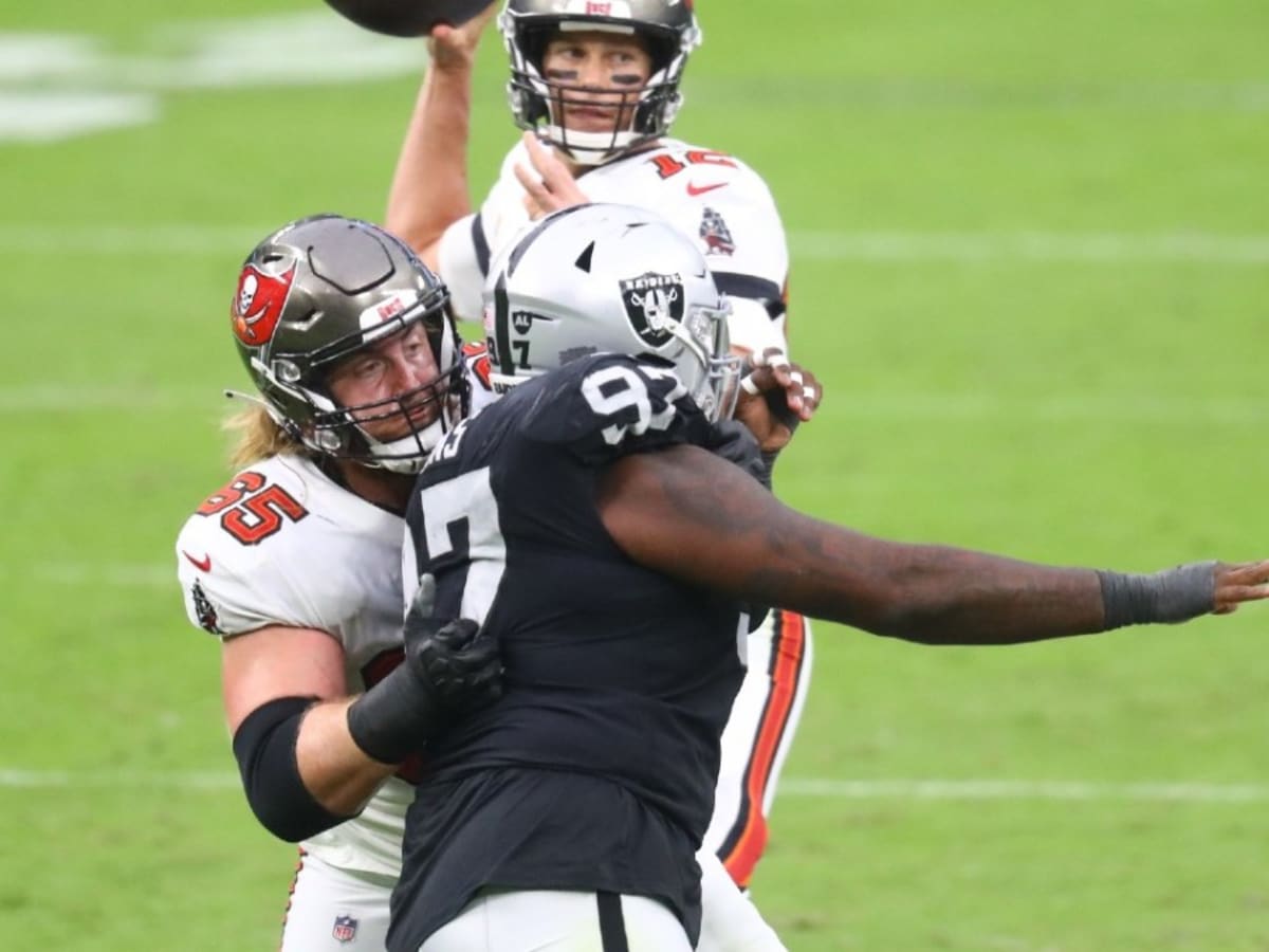 Tampa Bay Buccaneers guard Alex Cappa (65) reacts to the snap during a NFL  divisional playoff f …