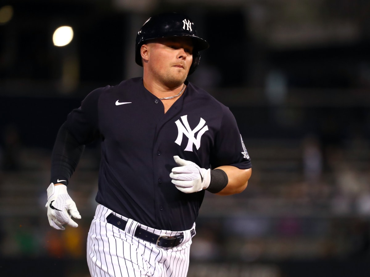 Luke Voit rips his jersey open after scoring from first on a Mike