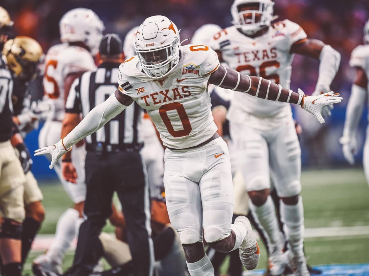 LOOK: DeMarvion Overshown sends message following Texas all-time low NFL  Draft - On3