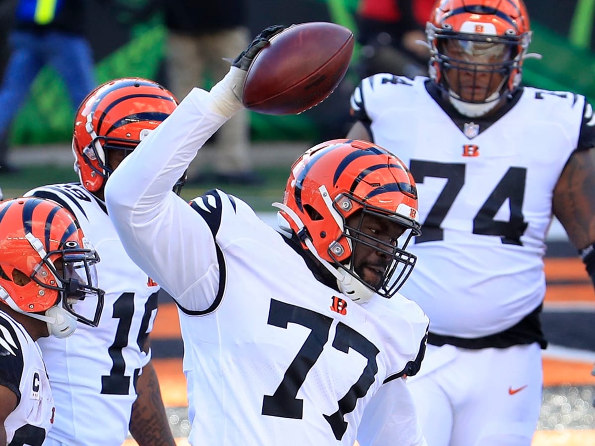 Cincinnati Bengals guard Hakeem Adeniji (77) warms up during an