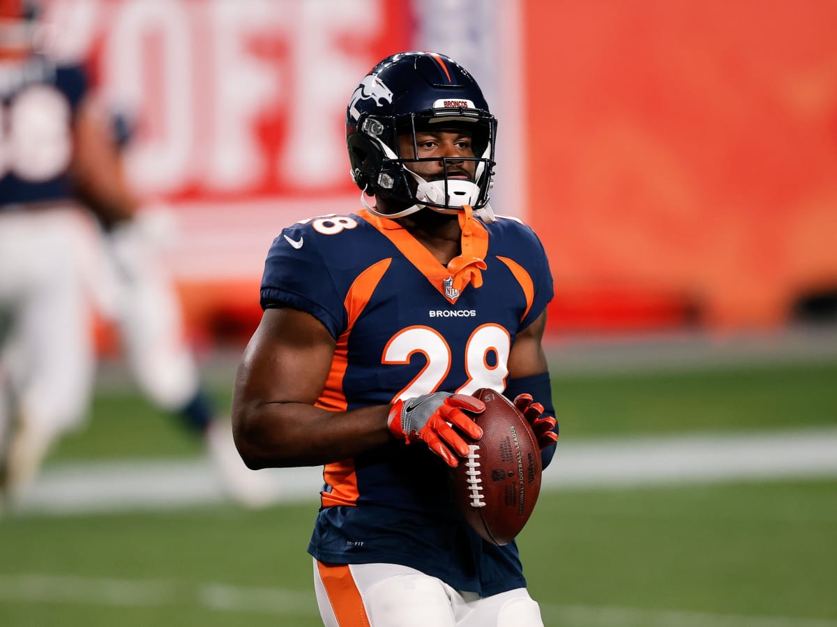 Denver Broncos running back LeVante Bellamy (32) chats with Denver Broncos  running back Royce Freeman (28) as they take part in drills during an NFL  football practice at the team's headquarters Monday