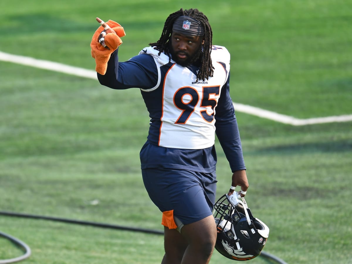 Denver Broncos defensive tackle McTelvin Agim (95) greets family