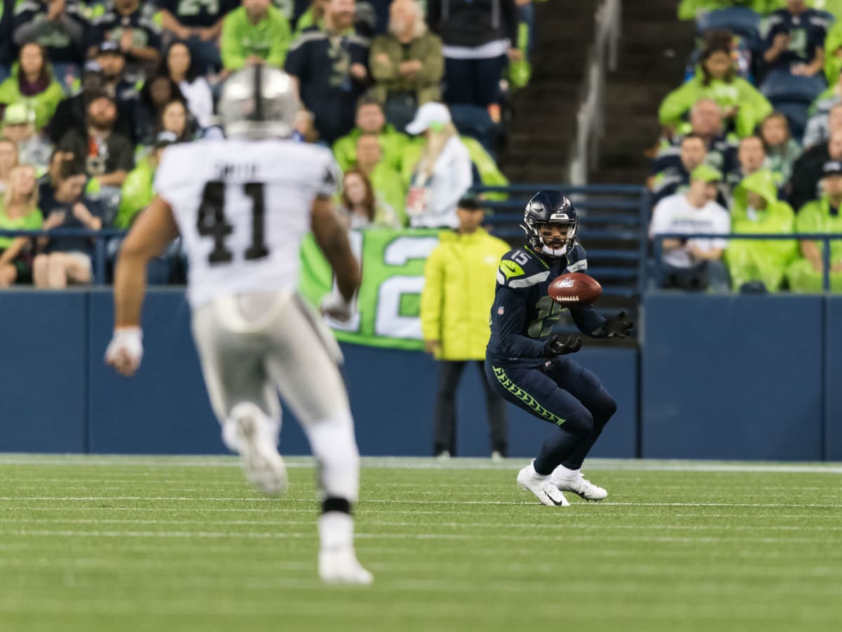 Seattle Seahawks wide receiver John Ursua (15) is tackled by Las Vegas  Raiders cornerback Amik …