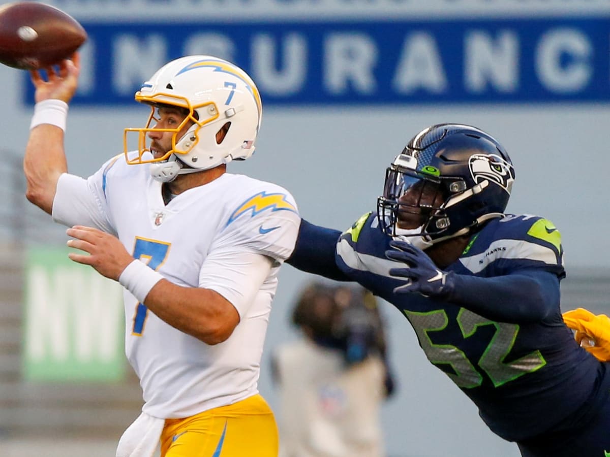 Seattle Seahawks defensive end Darrell Taylor (52) and defensive end L.J.  Collier celebrate during the first half of an NFL football game against the  Los Angeles Rams, Thursday, Oct. 7, 2021, in