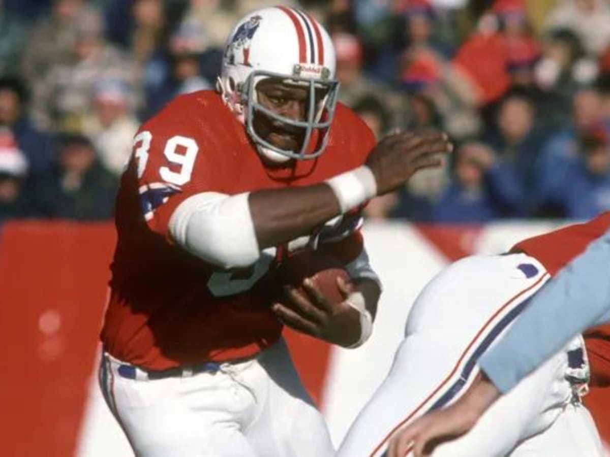 New England Patriots running back Sam Cunningham tries to get past