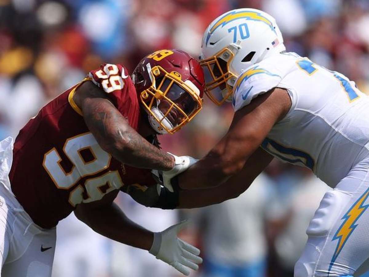 Tackle (70) Rashawn Slater of the Los Angeles Chargers blocks