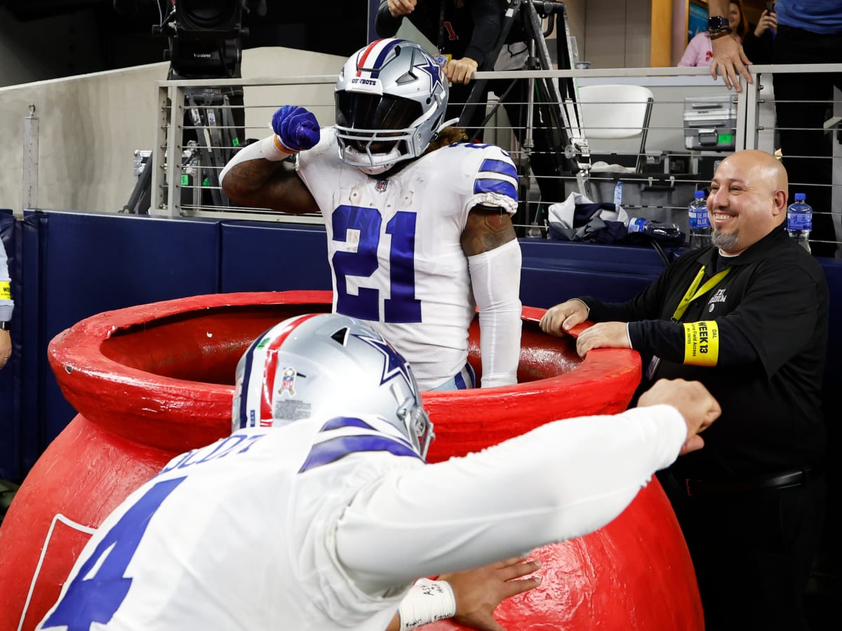 Dallas Cowboys running back Ezekiel Elliott (21) stands on stands against  the Denver Broncos in the first half of an NFL football game Saturday, Aug  13, 2022, in Denver. (AP Photo/Bart Young