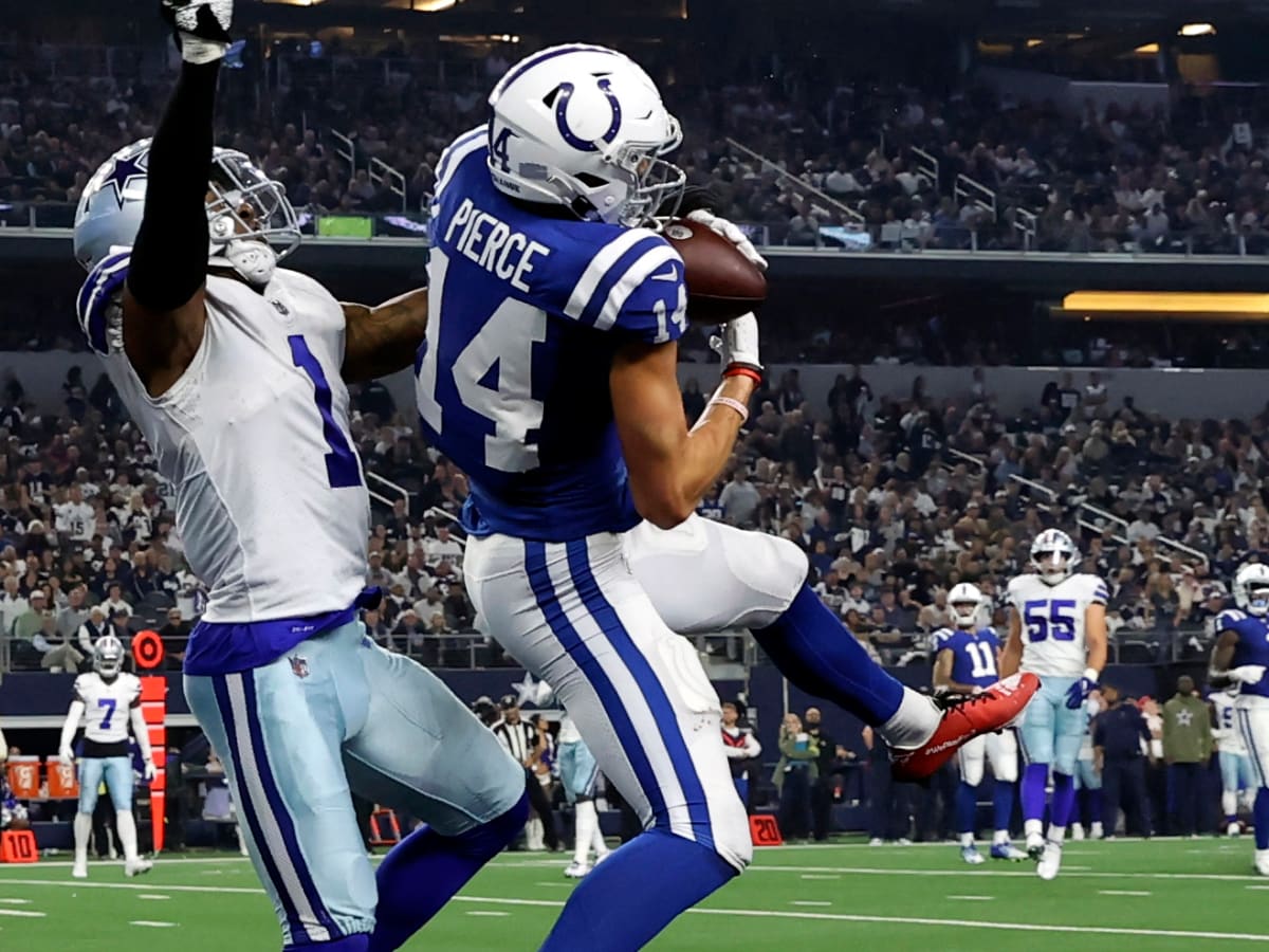 Indianapolis Colts wide receiver Alec Pierce reaches up to catch a pass  during an NFL football game against the Dallas Cowboys Sunday, Dec. 4,  2022, in Arlington, Texas. (AP Photo/Tony Gutierrez Stock