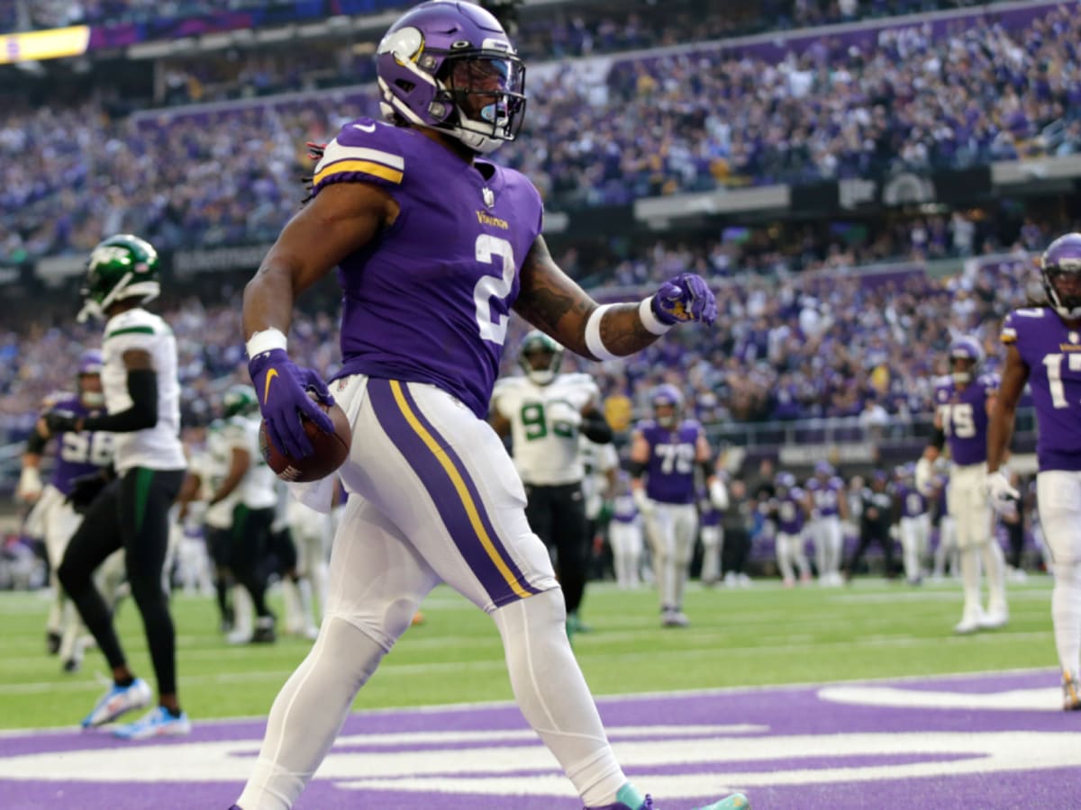 FILE - Minnesota Vikings running back Alexander Mattison (2) breaks a  tackle to score a touchdown in the first quarter of an NFL match between  Minnesota Vikings and New Orleans Saints at