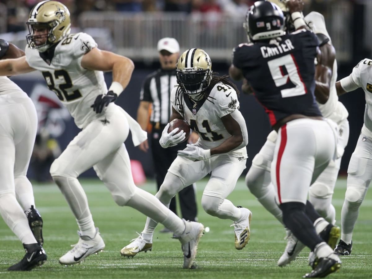 ATLANTA, GA - DECEMBER 06: Cornerback Isaiah Oliver #26 of the Atlanta  Falcons breaks up the pass to Running back Alvin Kamara #41 of the New  Orleans Saints during the week 13