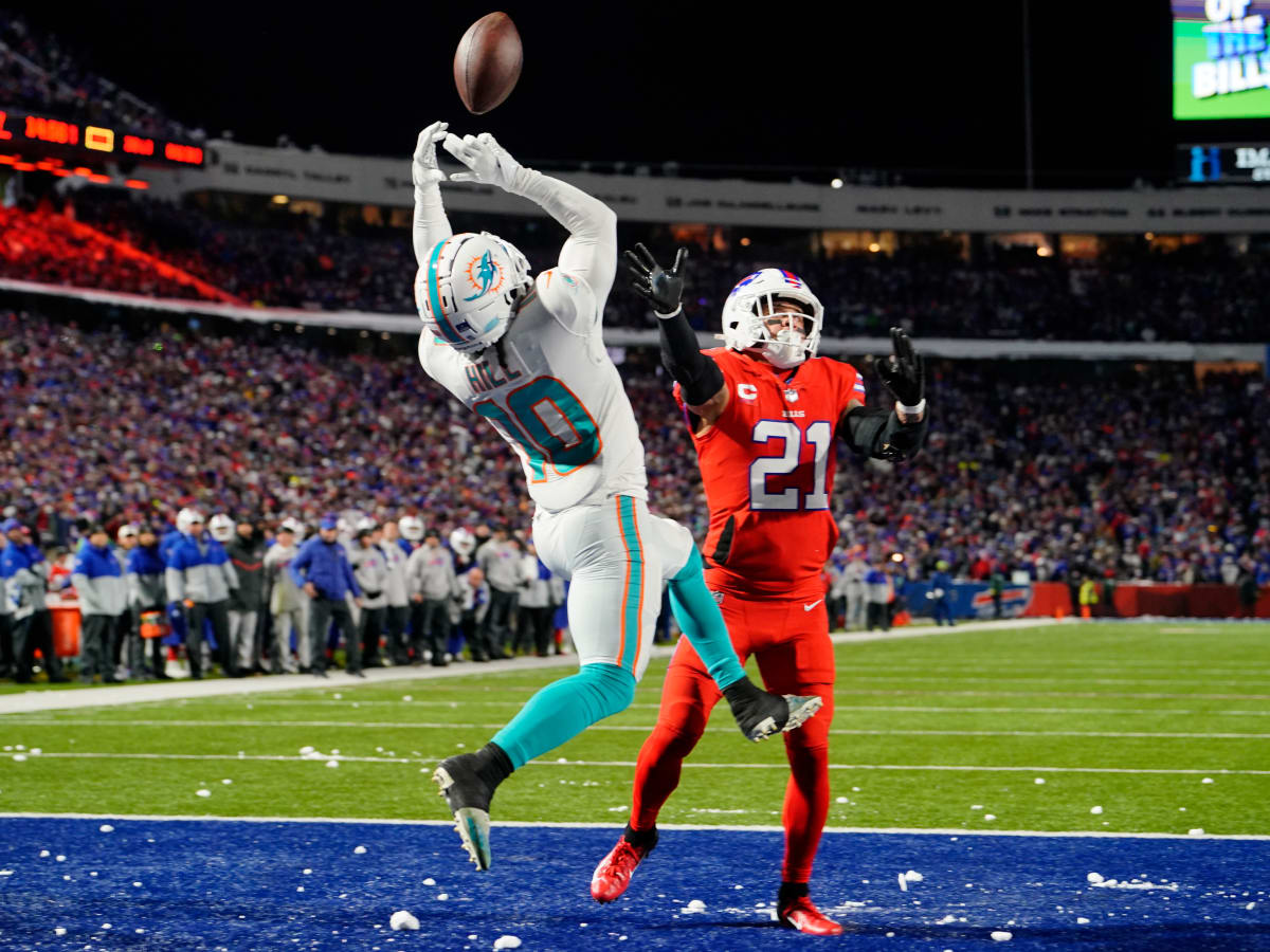 Buffalo Bills safety Jordan Poyer (21) and cornerback Tre'Davious White  (27) break up a pass intended for Cincinnati Bengals wide receiver Tee  Higgins (85) during the fourth quarter of an NFL division