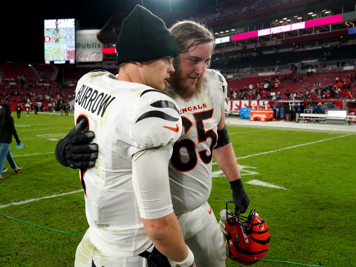 Cincinnati Bengals guard Alex Cappa (65) smiles as he walks off the field  after an NFL football game against the Carolina Panthers, Sunday, Nov. 6,  2022, in Cincinnati. (AP Photo/Emilee Chinn Stock