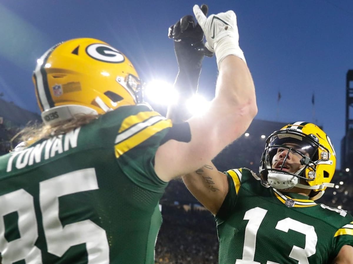 GREEN BAY, WI - SEPTEMBER 18: Green Bay Packers running back Aaron Jones  (33) celebrates with Green Bay Packers wide receiver Allen Lazard (13)  during a game between the Green Bay Packers