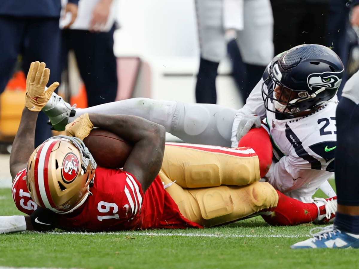 With late goal line stand, Seahawks hold on for wild win over 49ers 