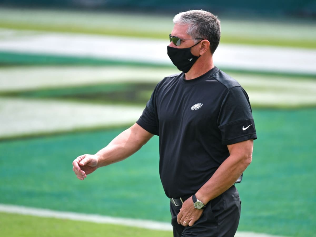 Kevin Stefanski gives the game ball to DC Jim Schwartz after