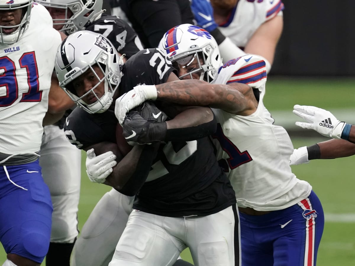 Las Vegas Raiders running back Josh Jacobs (28) gains yards on a