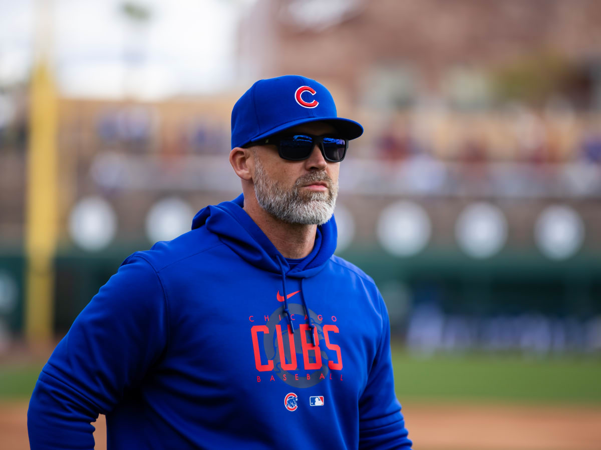 Chicago Cubs manager David Ross, second from left, talks to players during  the eighth inning of a baseball game against the Chicago White Sox in  Chicago, Wednesday, Aug. 16, 2023. (AP Photo/Nam