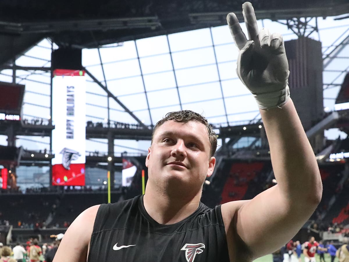 Atlanta Falcons guard Chris Lindstrom (63) and tight ends coach