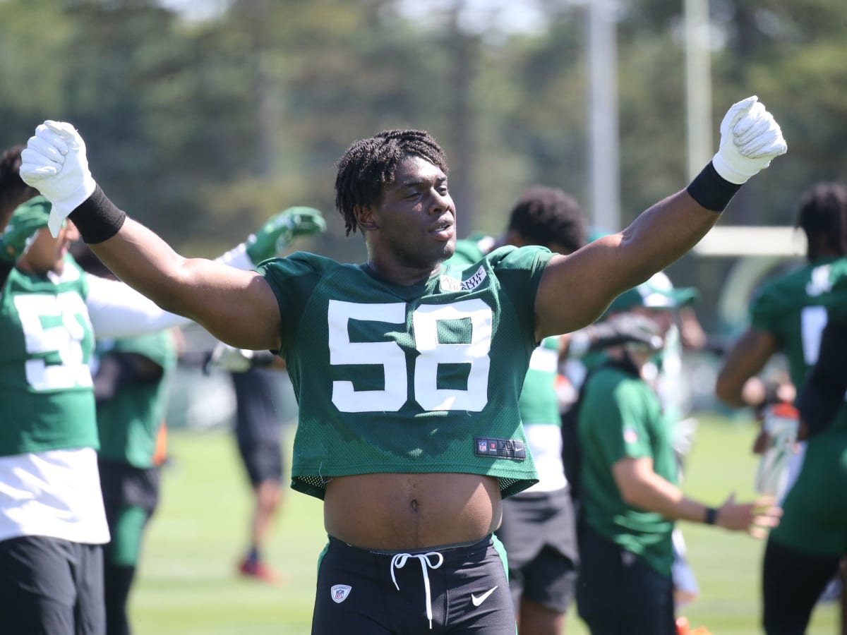 New York Jets defensive end Carl Lawson (58) waits for play to resume  during the second half of an NFL football game against the Miami Dolphins,  Sunday, Jan. 8, 2023, in Miami