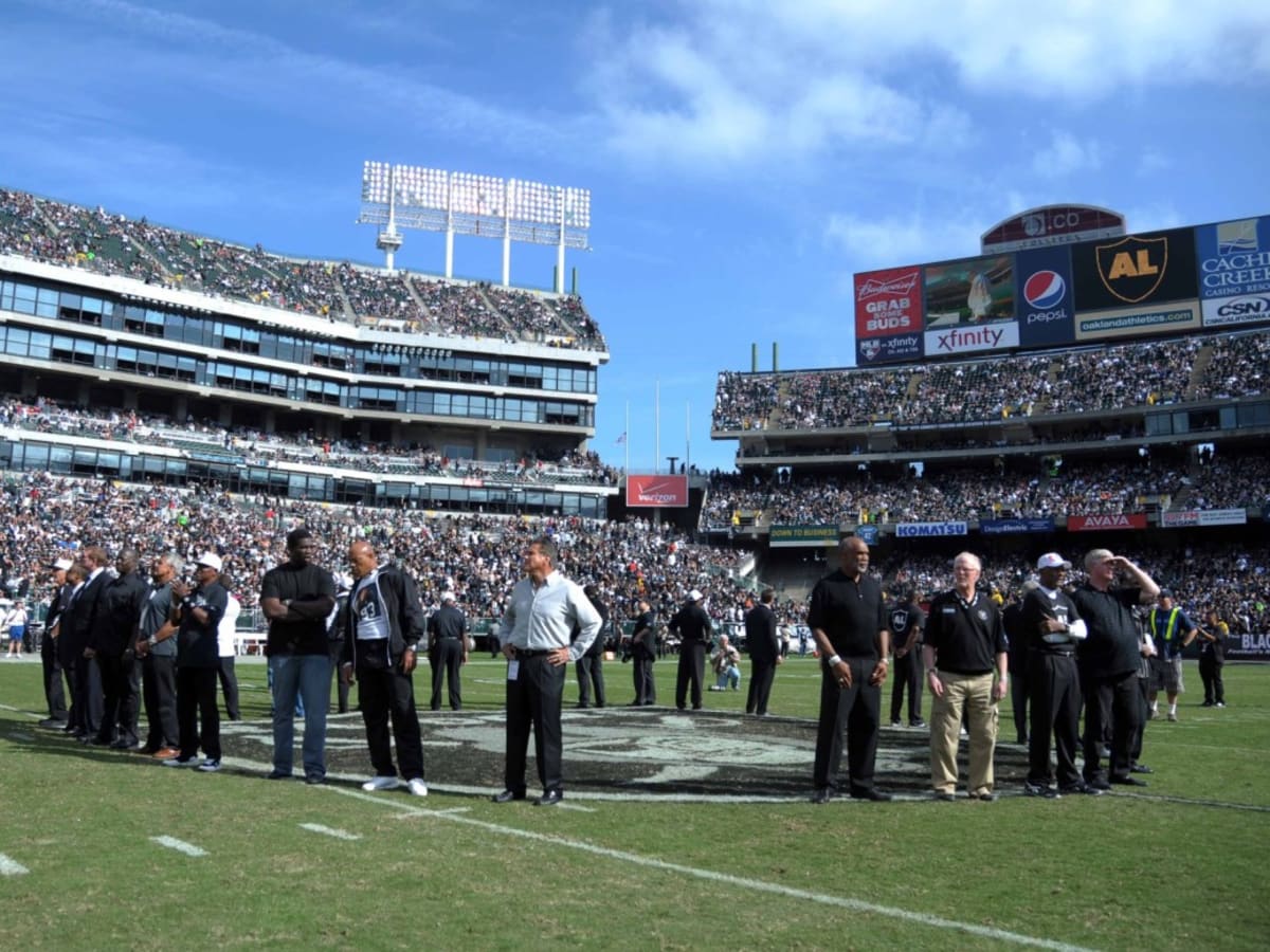 Oakland Raiders quarterback Jim Plunkett takes a snap during the