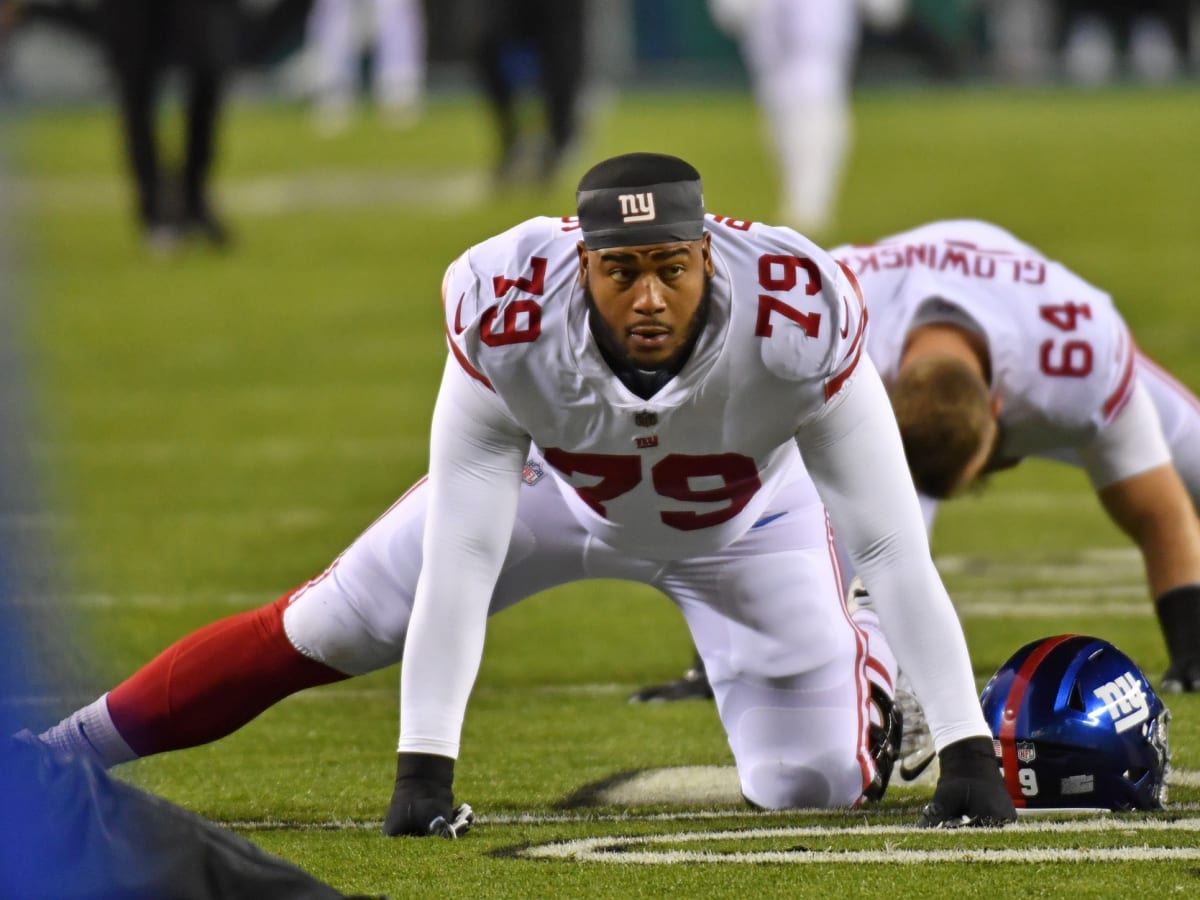 New York Giants guard Tyre Phillips (79) walks off the field at halftime of  an NFL