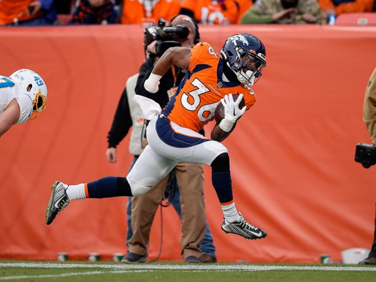 Tyler Badie of the Denver Broncos reacts after rushing for a