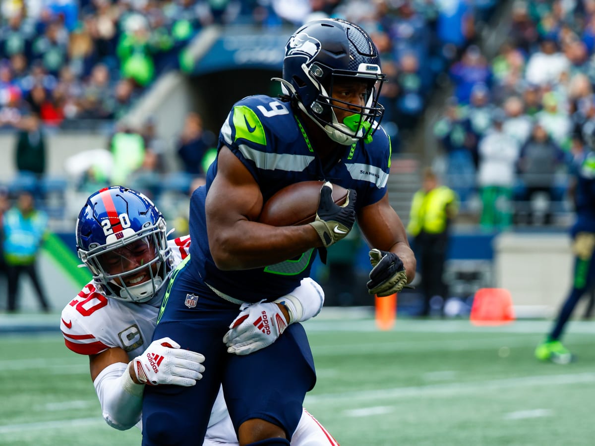 Seattle Seahawks quarterback Geno Smith (7) greets running back Zach  Charbonnet (26) during the NFL football team's training camp Thursday, Aug.  3, 2023, in Renton, Wash. (AP Photo/Lindsey Wasson Stock Photo - Alamy