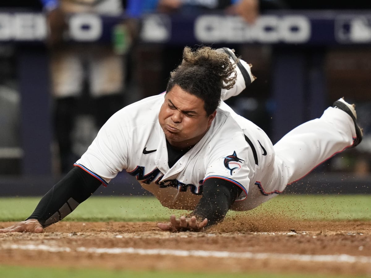 Willians Astudillo takes off his hat to catch a pop-up with his