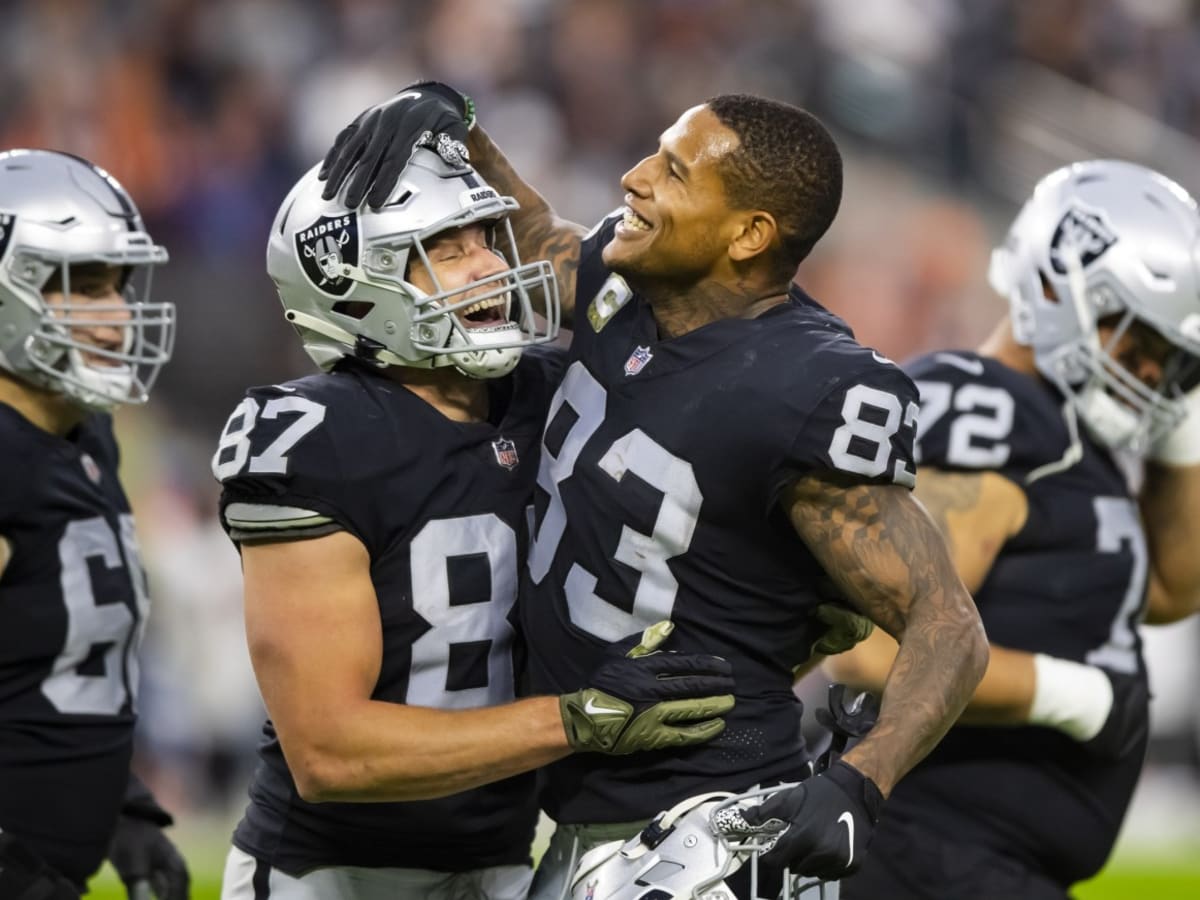 Las Vegas Raiders tight ends Cole Fotheringham (85), Nick Bowers (82), and  Jesper Horsted (80) talk against the New England Patriots during the first  half of an NFL preseason football game, Friday