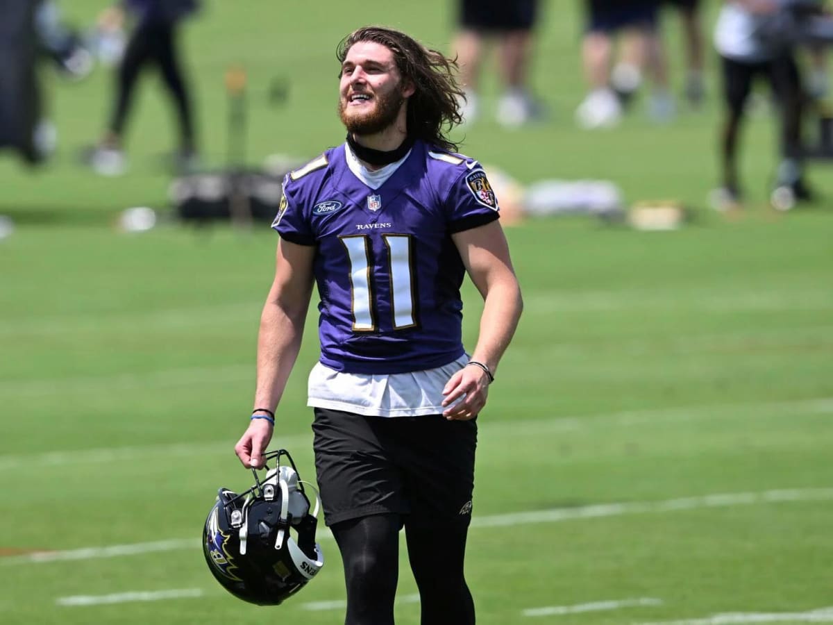 Baltimore Ravens punter Jordan Stout (11) runs off the field at halftime of  an NFL football game against the New England Patriots, Sunday, Sep. 25,  2022, in Foxborough, Mass. (AP Photo/Stew Milne