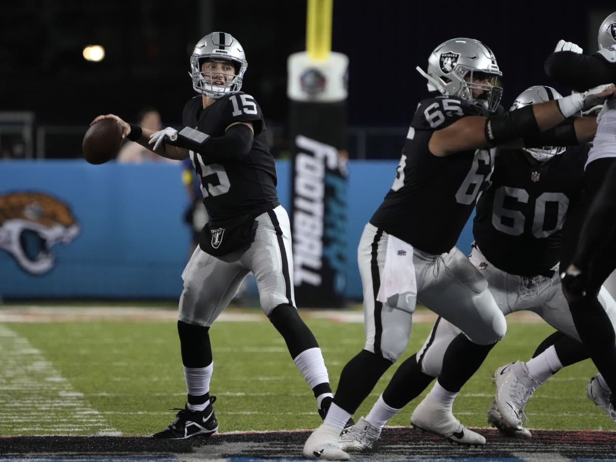 Las Vegas Raiders quarterback Chase Garbers (15) throws the ball on the  field before an NFL