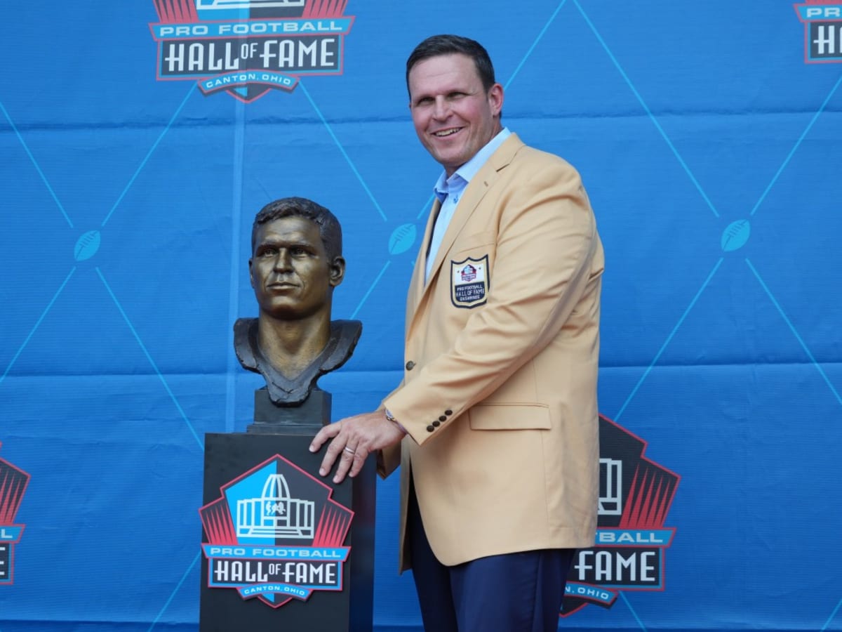 Former Jacksonville Jaguars offensive tackle Tony Boselli, center, stands  with members of his family after a ceremony, where he was presented with  his Pro Football Hall of Fame ring and had his