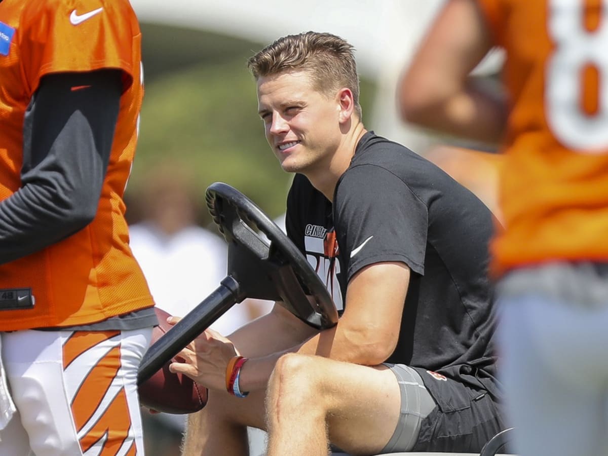 LANDOVER, MD - NOVEMBER 22: Doctors and athletic trainers help Bengals  quarterback Joe Burrow (9) onto the medical cart after being injured as  Washington defensive end Chase Young (99) and quarterback Dwayne