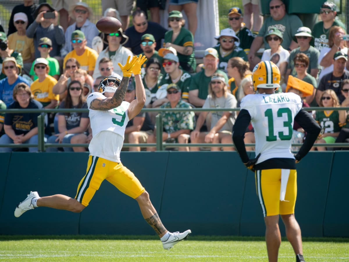 Green Bay Packers' Christian Watson practices before the first