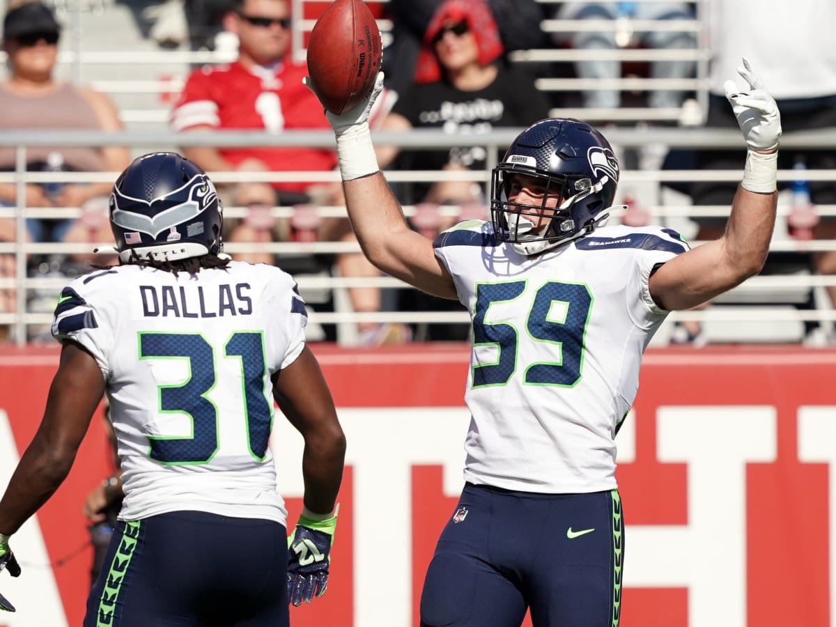 Seattle Seahawks linebacker Jon Rhattigan (59) runs down the field during  an NFL pre-season football game against the Minnesota Vikings, Thursday,  Aug. 10, 2023 in Seattle. (AP Photo/Ben VanHouten Stock Photo - Alamy