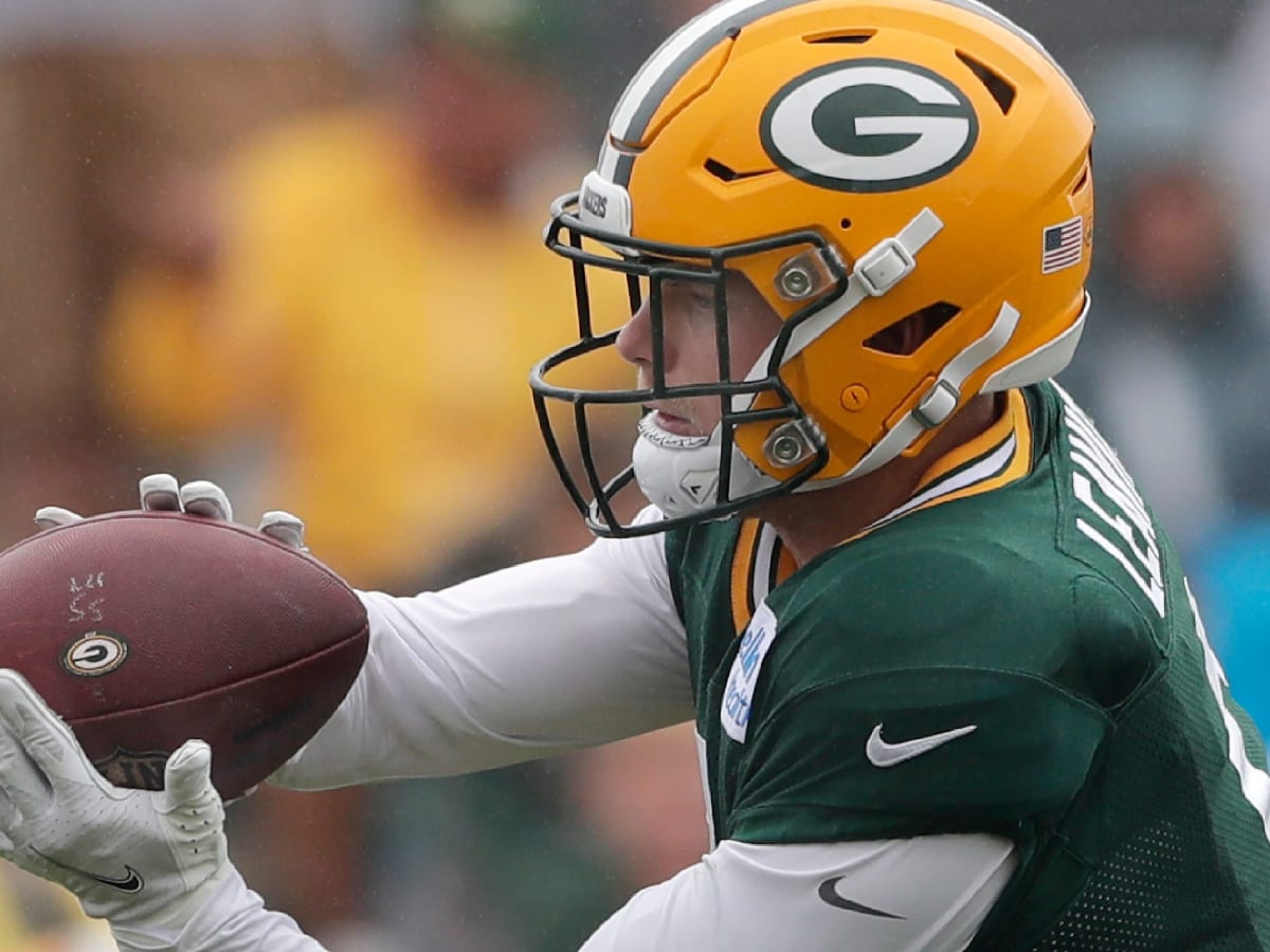 Green Bay Packers safety Dallin Leavitt (6) celebrates with teammates after  making an interception during a