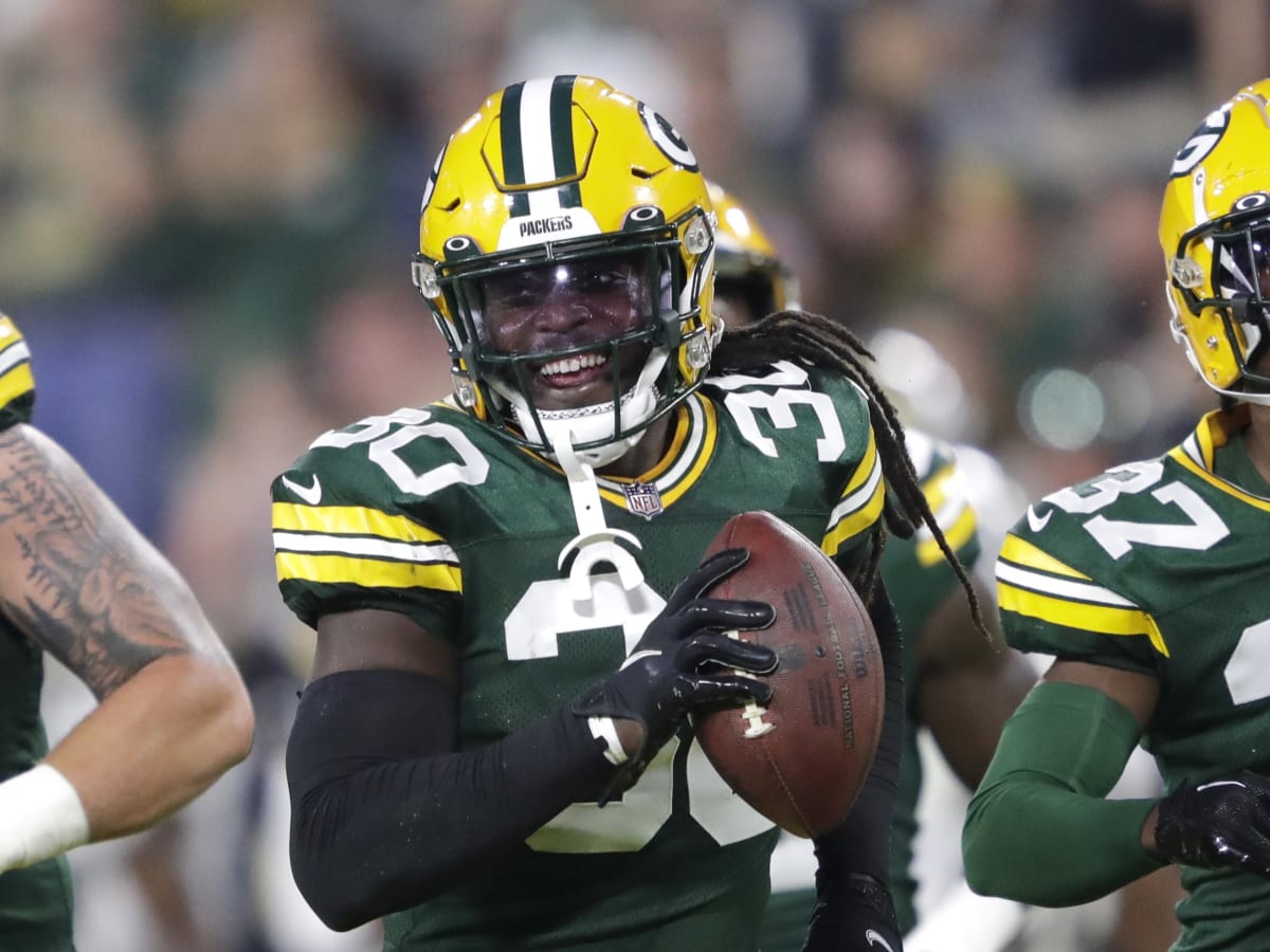 Green Bay Packers safety Shawn Davis (30) runs with the ball after