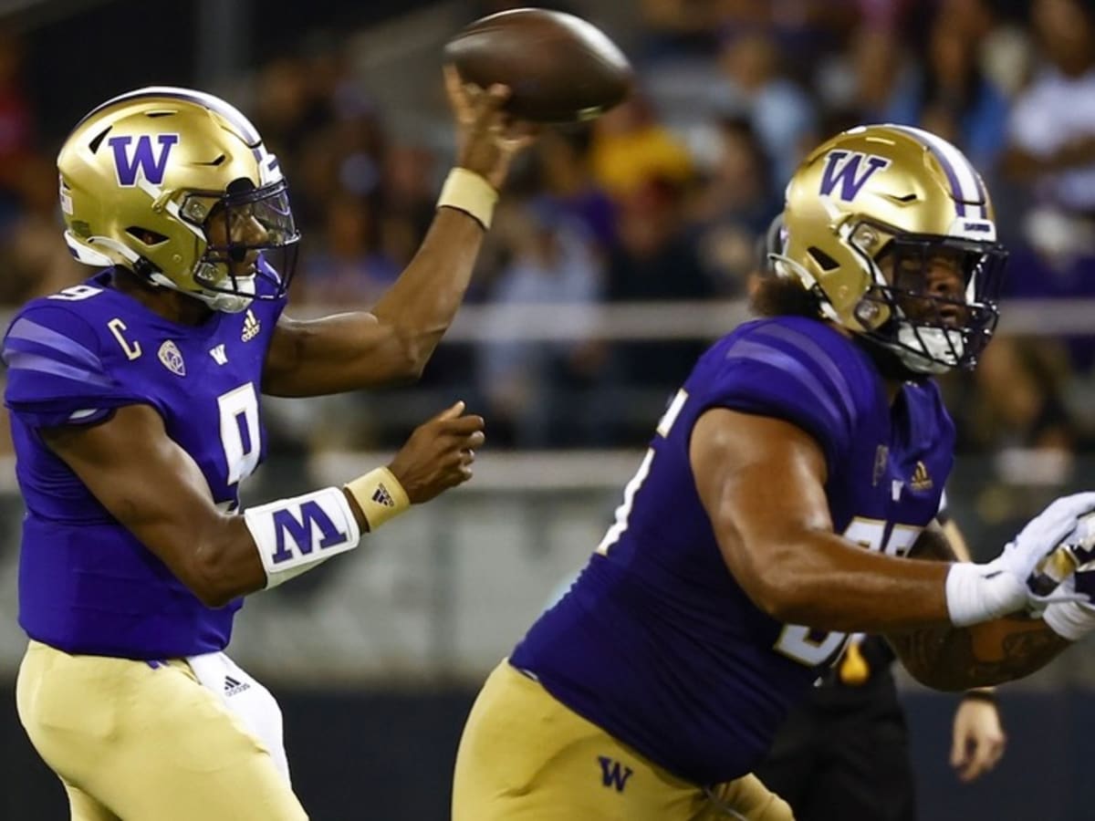 Washington Huskies finally get a win with 52-3 romp over Arkansas State 