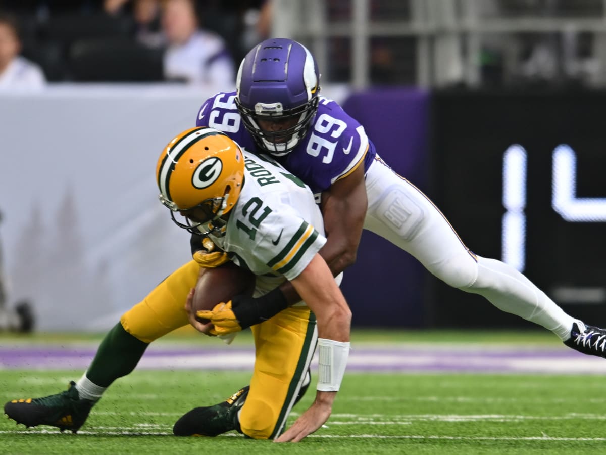 Minnesota Vikings' Danielle Hunter sacks Green Bay Packers' Aaron Rodgers  during the second hal …